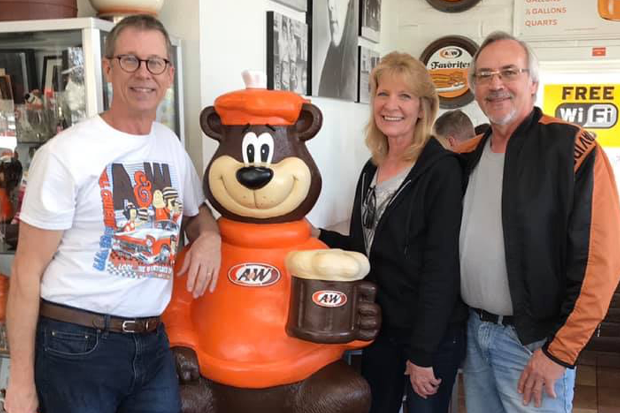 Carol &amp;amp; Mark pose beside a Rooty the Great Root Bear statue with A&amp;amp;W Lodi, CA Owner Pete 